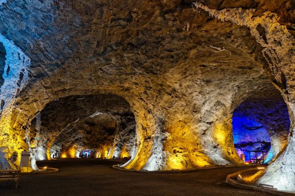 Serene salt cave with warm lighting and comfortable seating for relaxation
